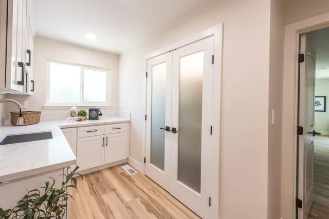 a room with a bed and a dresser