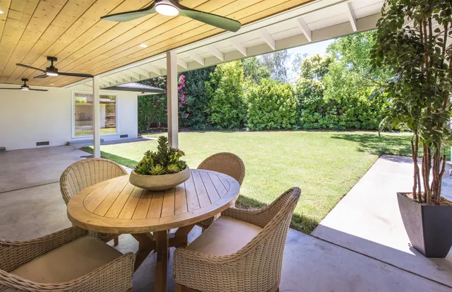 a view of a patio with couches chairs and a table