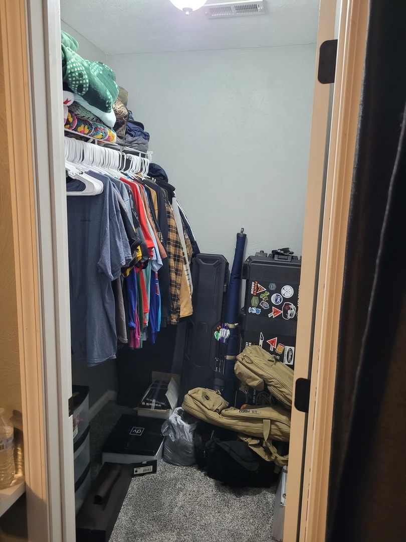 1102 East Bethel Road Mount Vernon, IL 62864 - Photo 14 of 16 a view of walk in closet with clothes and shoes
