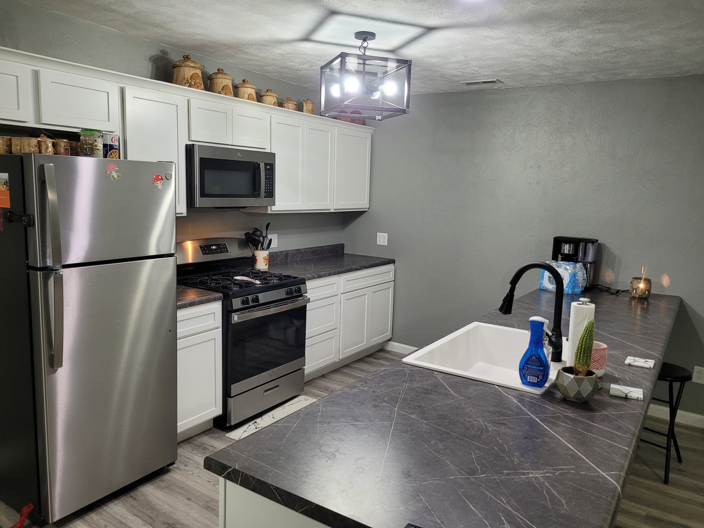 1102 East Bethel Road Mount Vernon, IL 62864 - Photo 7 of 16 a kitchen with stainless steel appliances granite countertop a refrigerator a stove top oven a sink and dishwasher