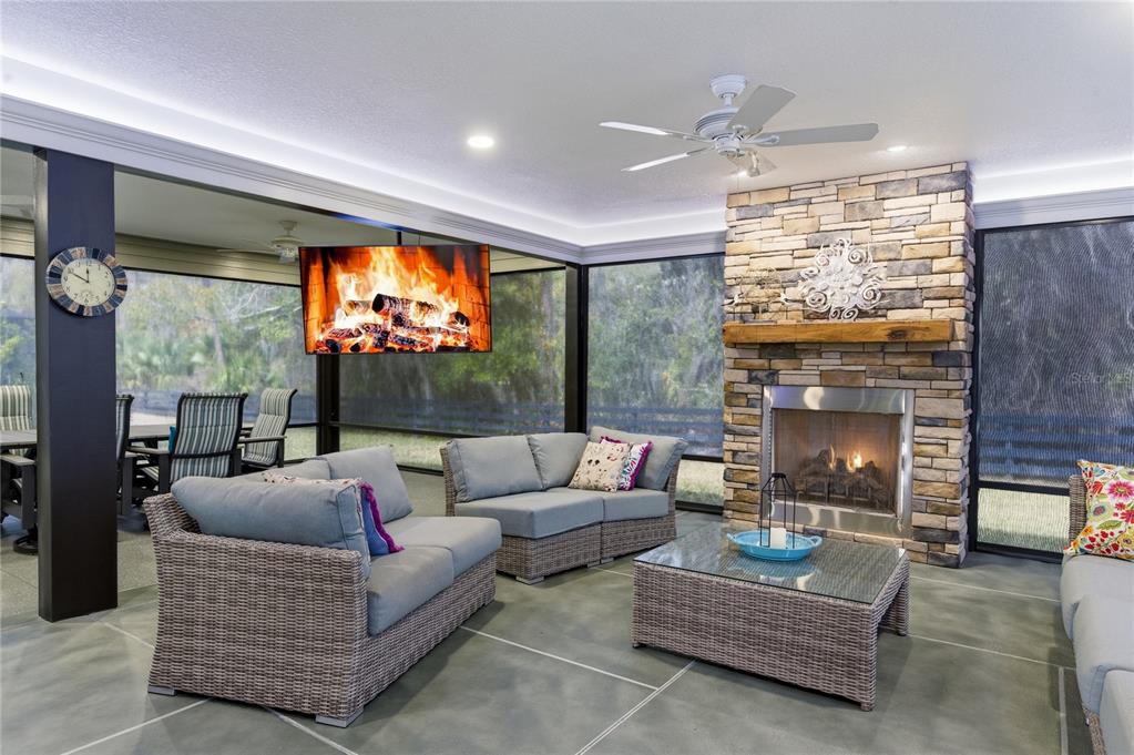 4788 Rostas Way The Villages, FL 32163 - Photo 11 of 40 a living room with furniture a fireplace and a flat screen tv