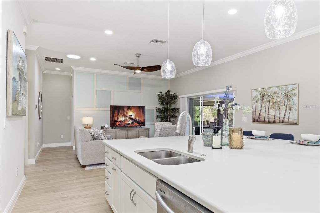 4788 Rostas Way The Villages, FL 32163 - Photo 17 of 40 a kitchen with a sink and a refrigerator