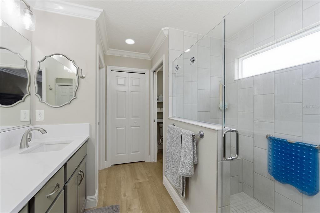 4788 Rostas Way The Villages, FL 32163 - Photo 22 of 40 a bathroom with a double vanity sink mirror and shower