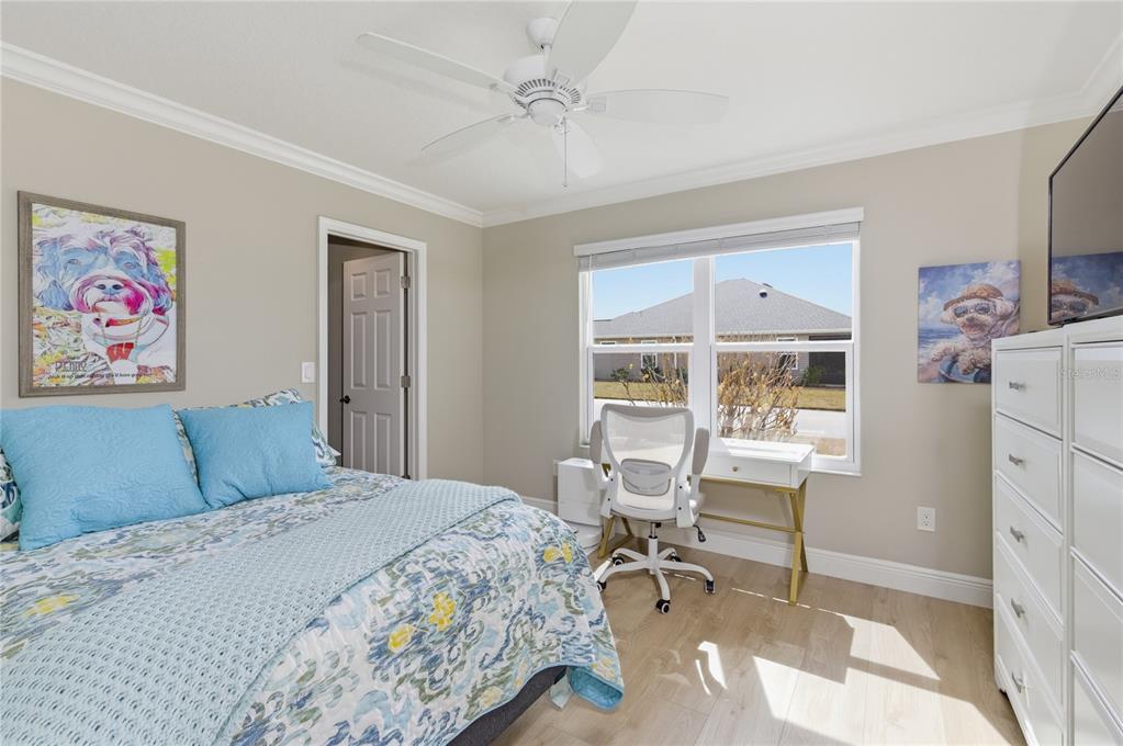 4788 Rostas Way The Villages, FL 32163 - Photo 24 of 40 a bedroom that has a bed and a chair in it