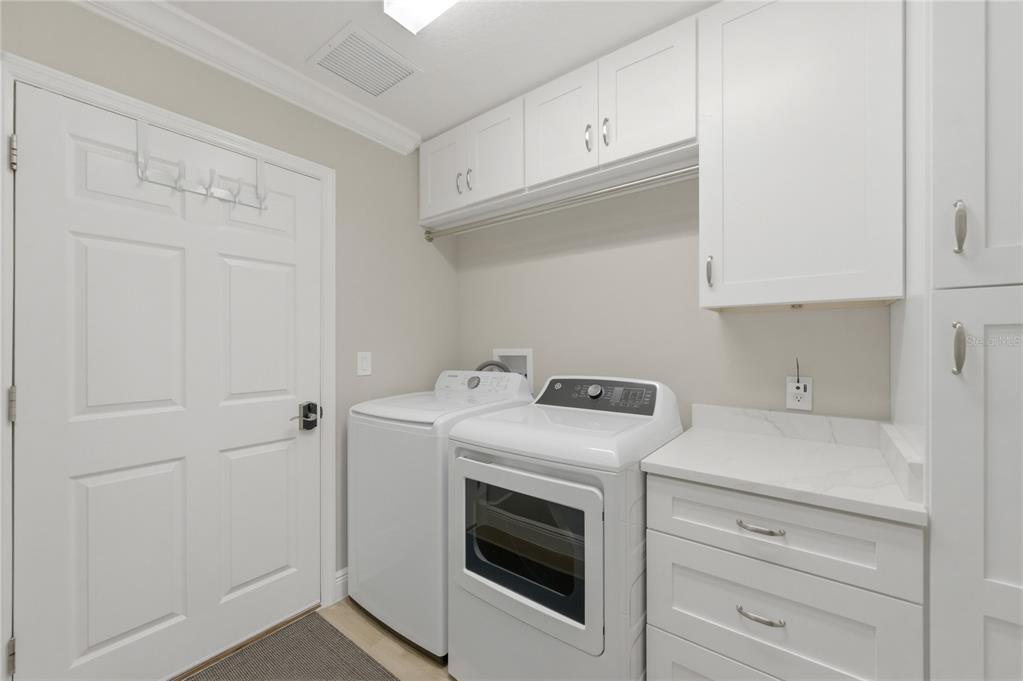 4788 Rostas Way The Villages, FL 32163 - Photo 28 of 40 a utility room with dryer and washer