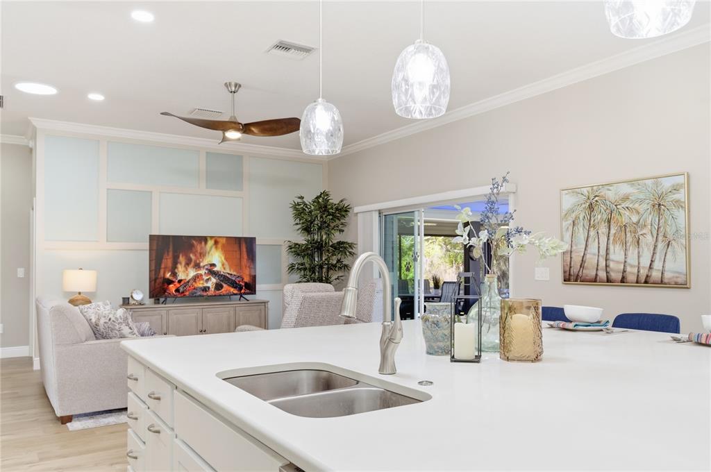 4788 Rostas Way The Villages, FL 32163 - Photo 30 of 40 a living room with furniture and a flat screen tv