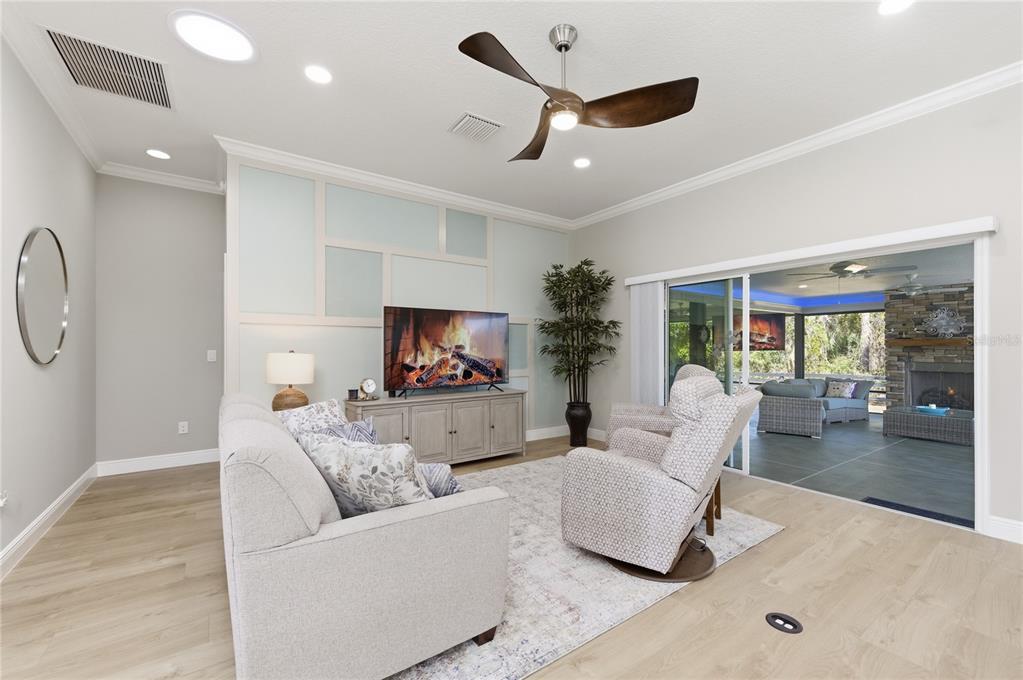4788 Rostas Way The Villages, FL 32163 - Photo 5 of 40 a living room with furniture and a flat screen tv