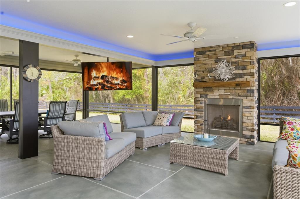 4788 Rostas Way The Villages, FL 32163 - Photo 6 of 40 a living room with furniture a fireplace and a flat screen tv