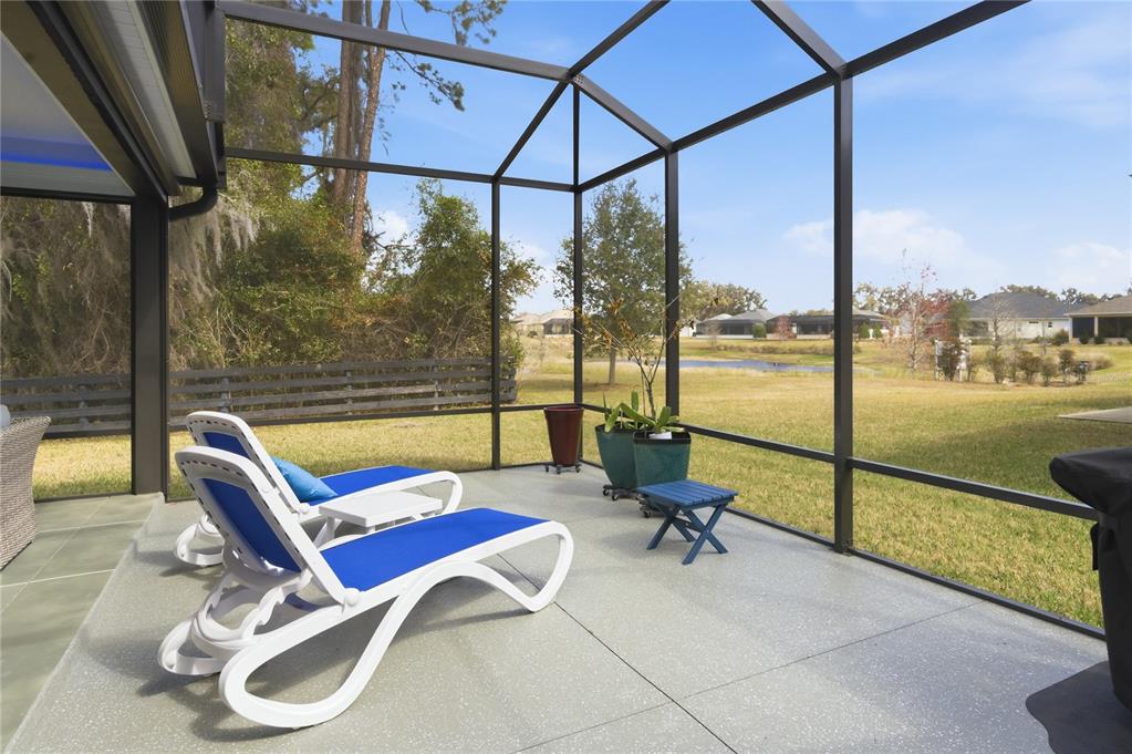4788 Rostas Way The Villages, FL 32163 - Photo 10 of 40 a view of a swimming pool with a lounge chair
