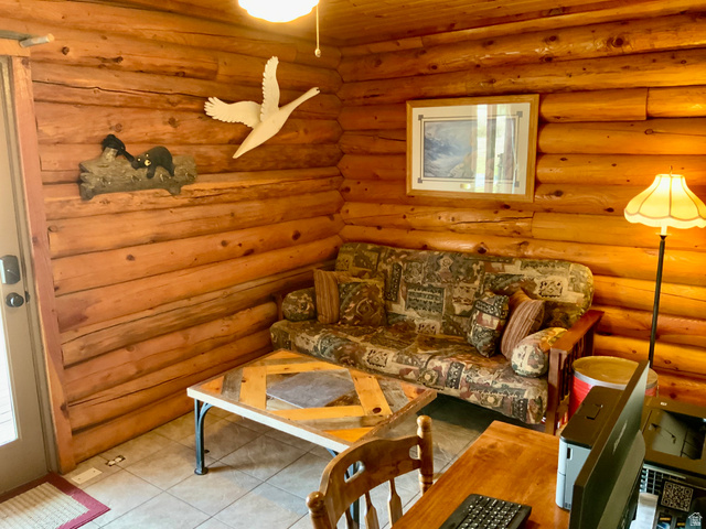 76 Highway 118 Monroe, UT 84754 - Photo 53 of 76 Tiled living area with log walls and wooden ceiling