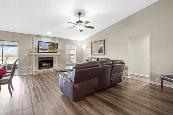 a living room with furniture and a fireplace