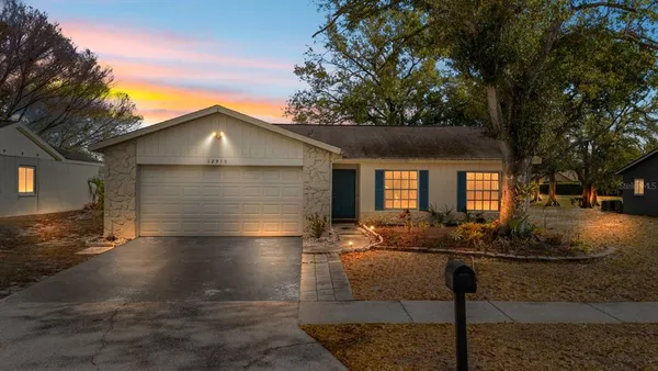 a view of backyard of house with seating space