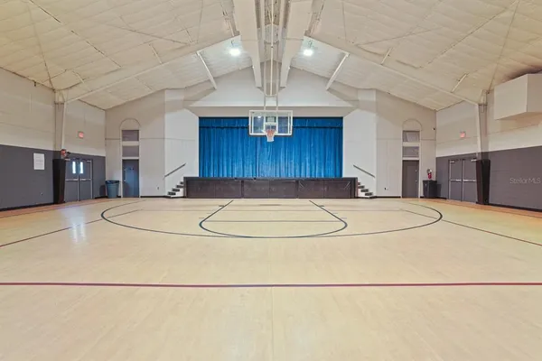 a view of a swimming pool with outdoor seating