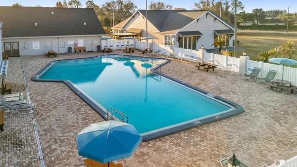 a view of a swimming pool with a lake view