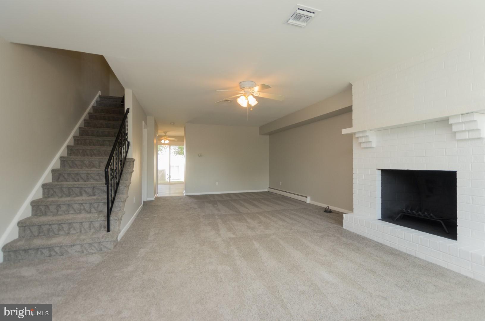 804 Walnut Ridge Drive Pottstown, PA 19464 - Photo 2 of 19 Large living room with wood-burning fireplace!