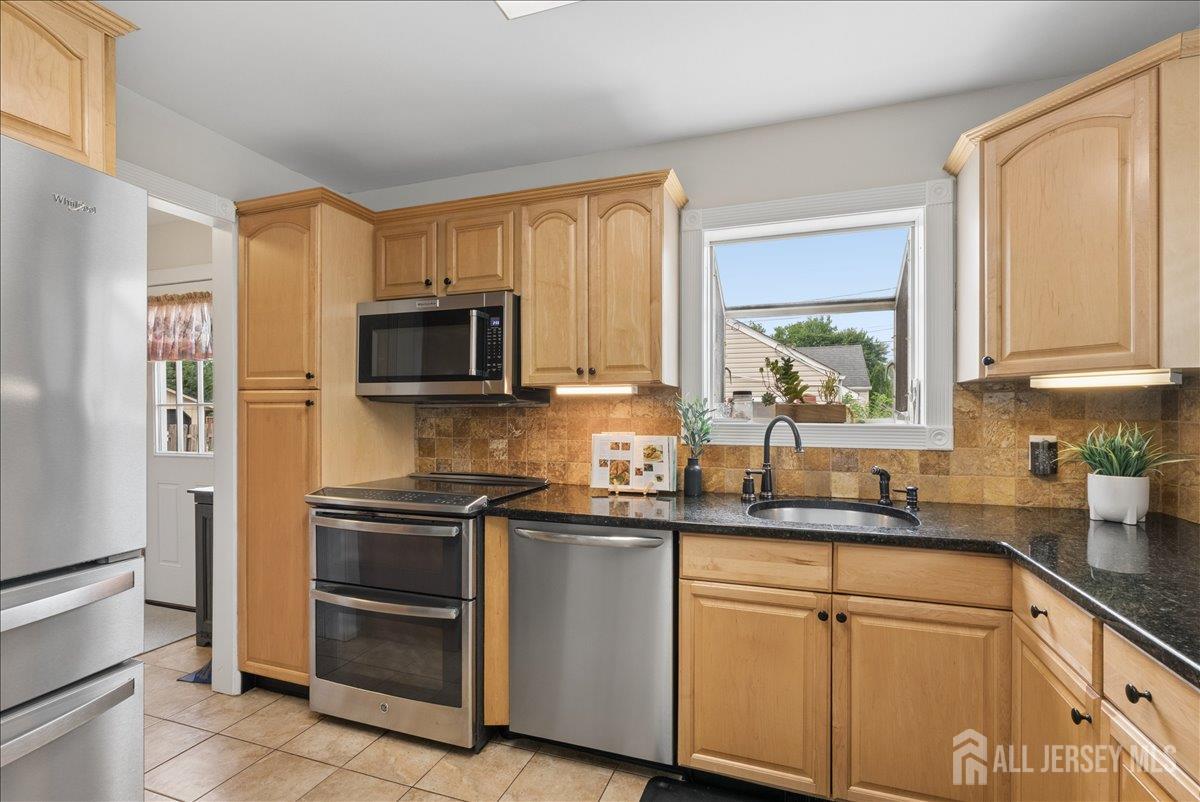 45 Walnut Street Edison, NJ 08817 - Photo 9 of 28 a kitchen with a sink stove and refrigerator