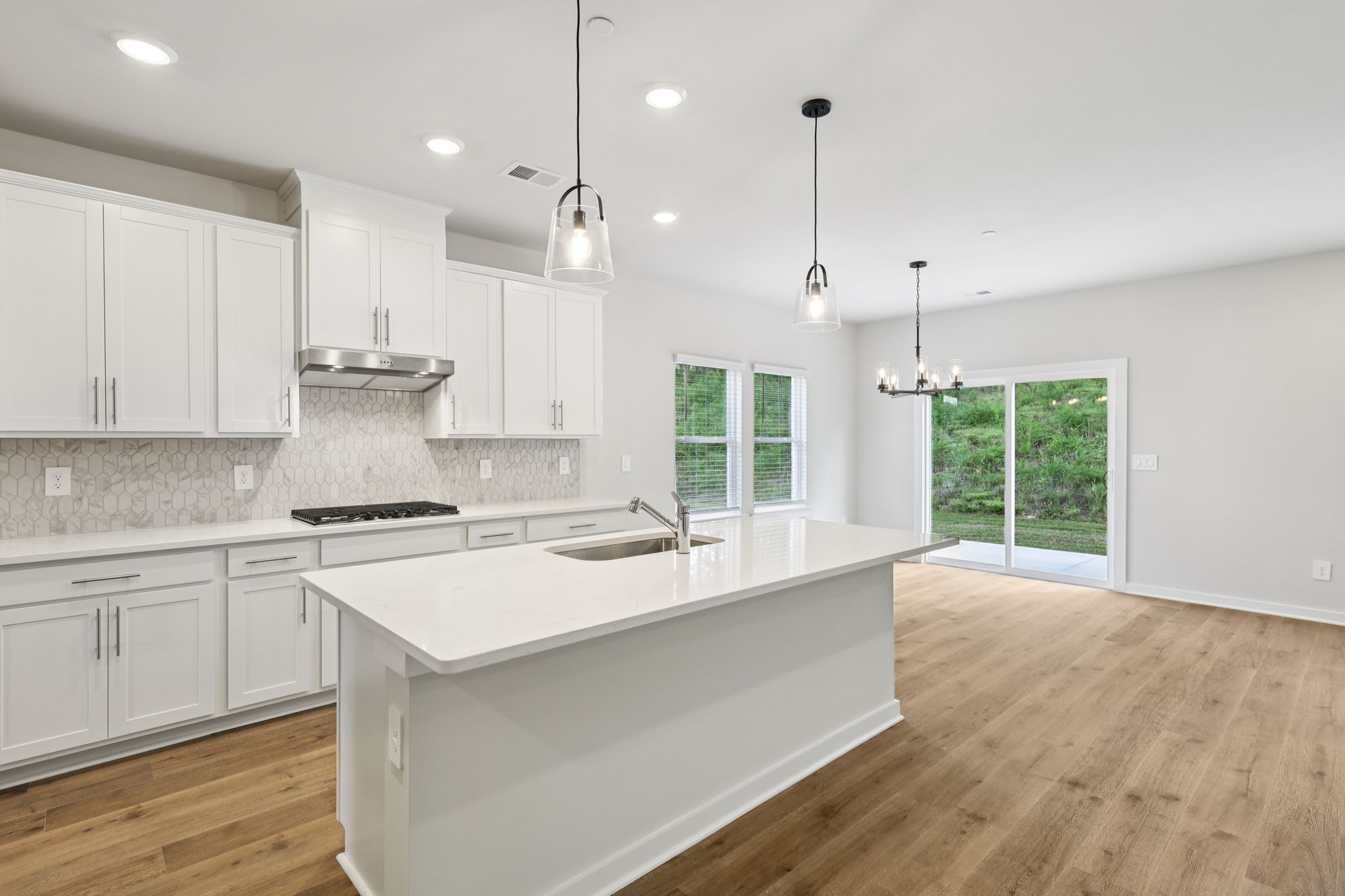 323 Zen Court Smyrna, TN 37167 - Photo 16 of 65 a large kitchen with kitchen island a large island in it