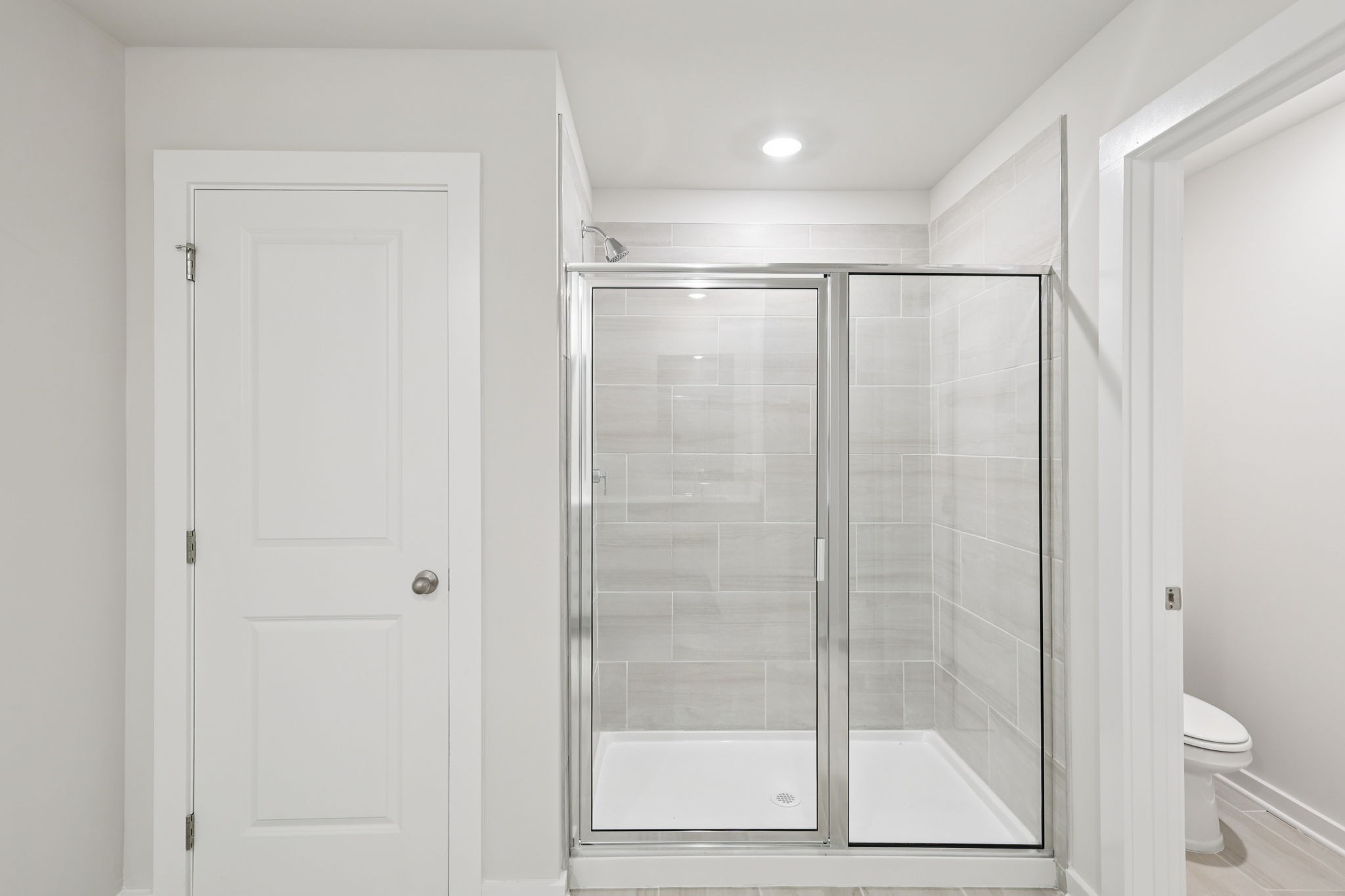 323 Zen Court Smyrna, TN 37167 - Photo 51 of 65 a bathroom with a glass shower door