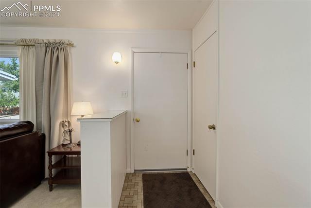 68 Louis Nelson Road Pueblo, CO 81001 - Photo 12 of 38 Doorway featuring light colored carpet
