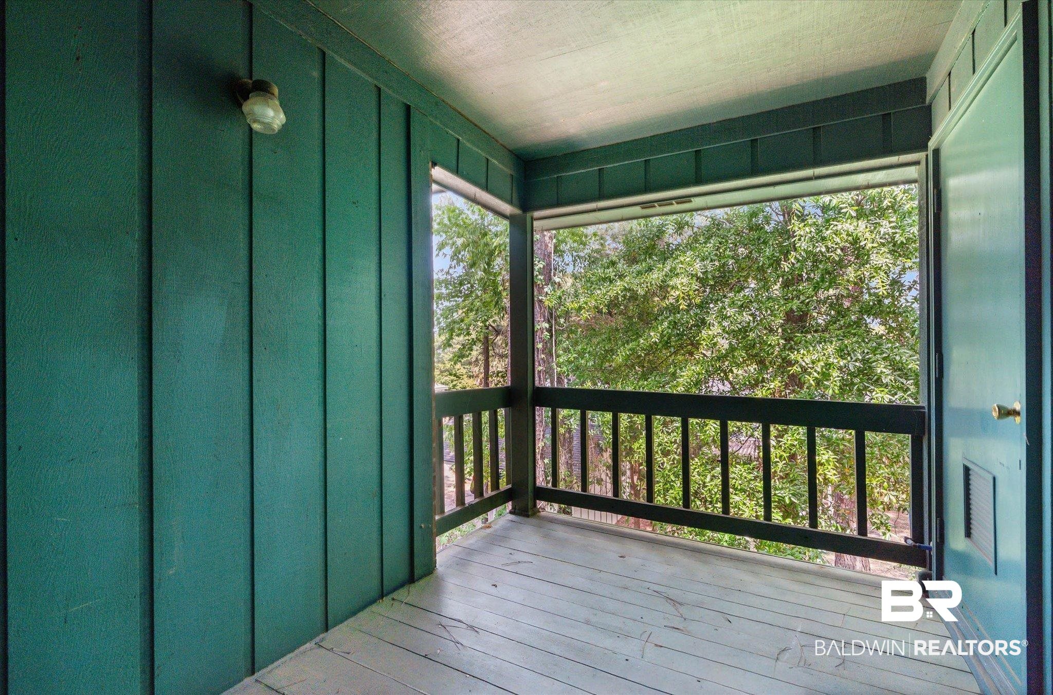 500 Grant Street, Unit C210 Daphne, AL 36526 - Photo 23 of 26 Private balcony featuring wood-finish flooring, a wood railing, and plank siding