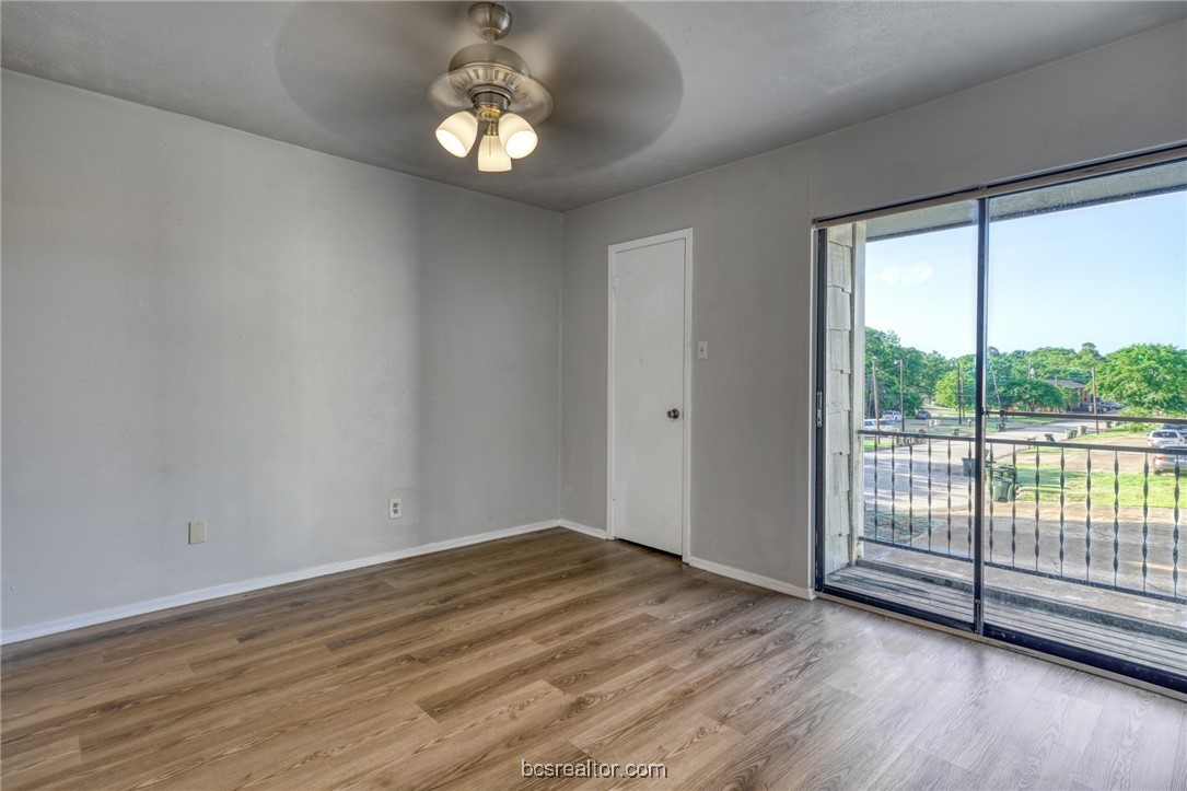 2400 Toro Lane, Unit A Bryan, TX 77807 - Photo 4 of 8 a view of a livingroom with wooden floor and a large window