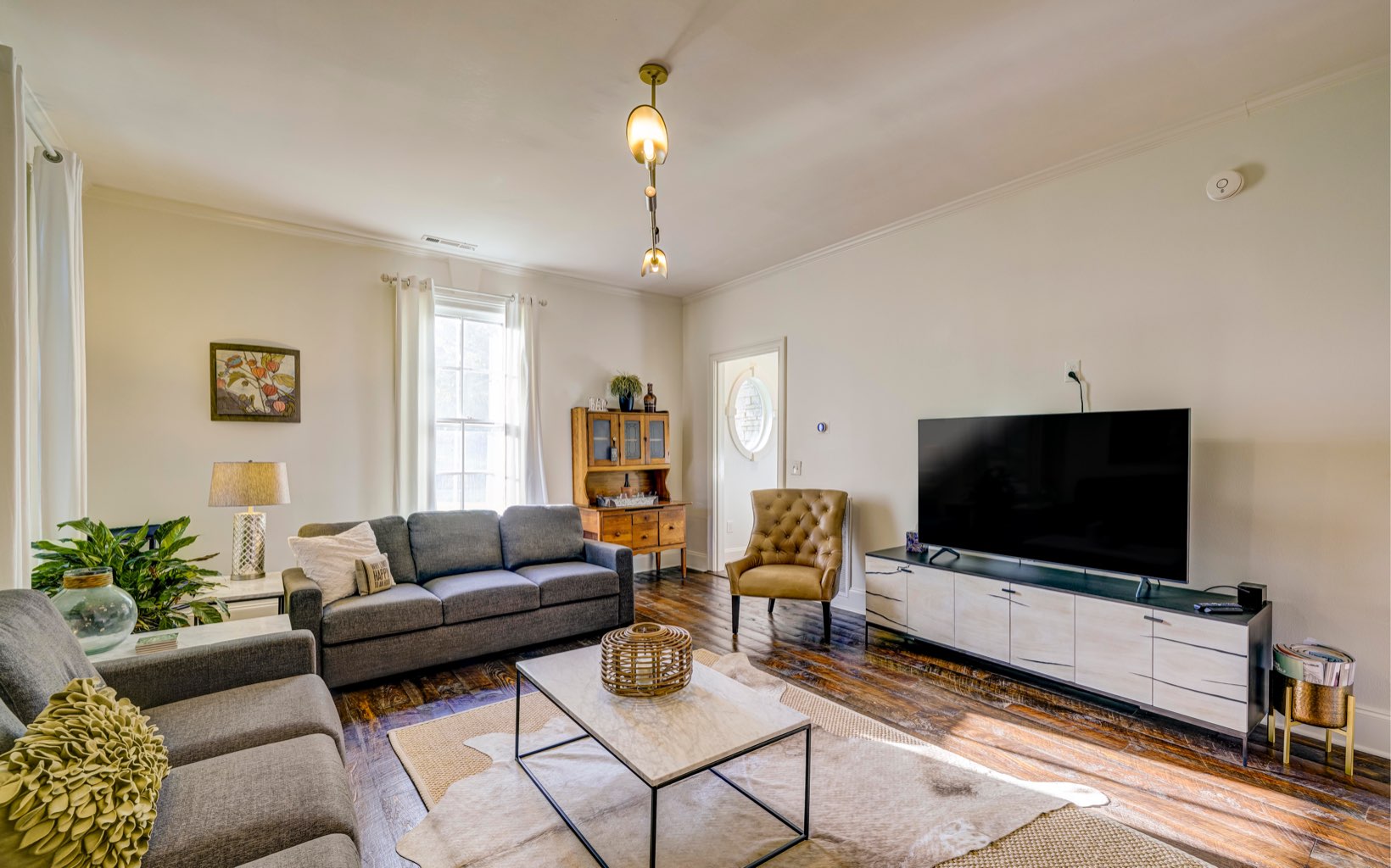 222 Ada Street Blue Ridge, GA 30513 - Photo 39 of 74 a living room with furniture and a flat screen tv