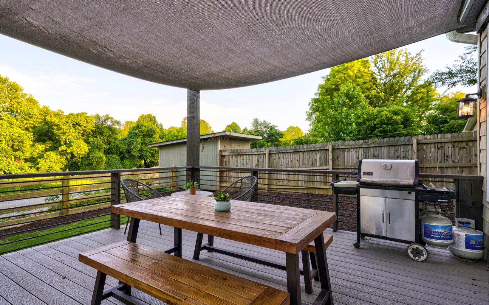 222 Ada Street Blue Ridge, GA 30513 - Photo 51 of 74 a view of a roof deck with table and chairs a barbeque with wooden floor and fence