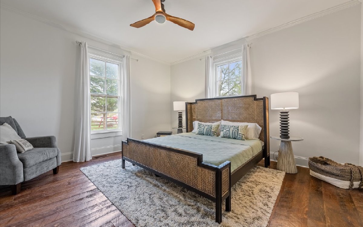 222 Ada Street Blue Ridge, GA 30513 - Photo 53 of 74 a bedroom with a bed and wooden floor