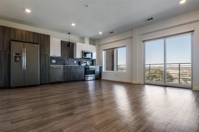 a view of a electric appliances in kitchen and wooden floor