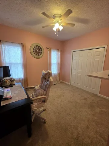 a workspace with furniture and chandelier