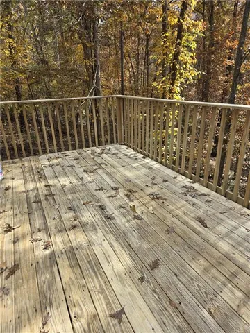a view of balcony with wooden floor