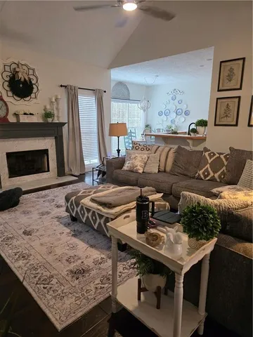 a living room with furniture and a fireplace