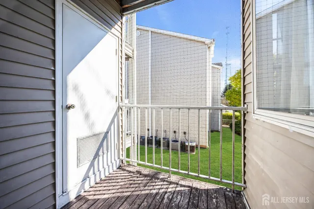 a view of a balcony with a floor to ceiling window