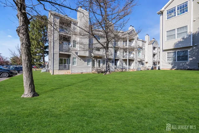 a view of a building with a yard