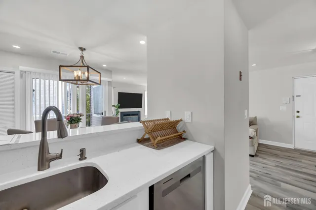 a kitchen with a sink and a refrigerator