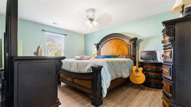 a bedroom with a bed and dresser
