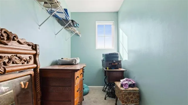 a view of hallway with wooden floor