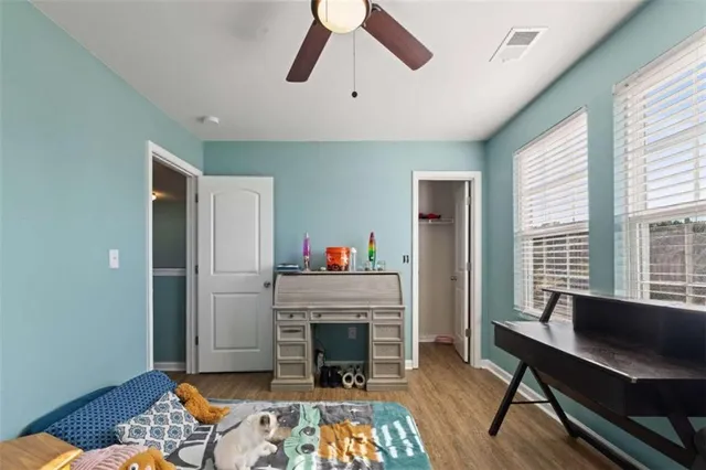 a view of a patio with a table chairs and a backyard