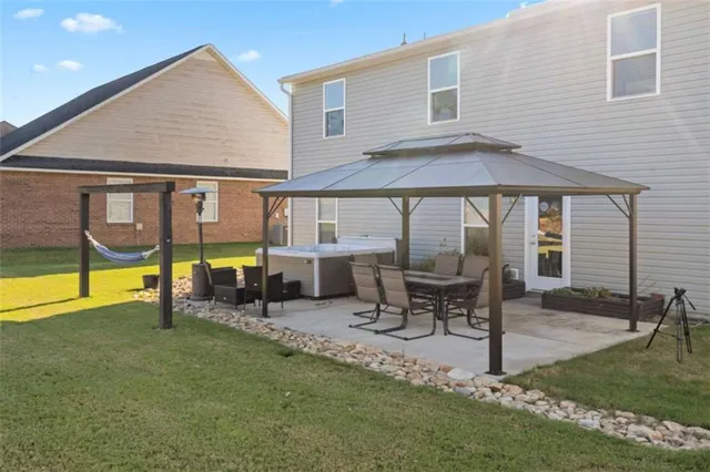 a patio with a table and chairs