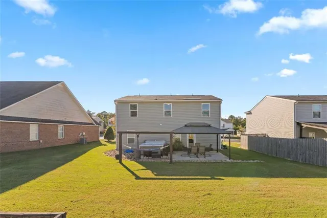 an aerial view of residential houses with outdoor space