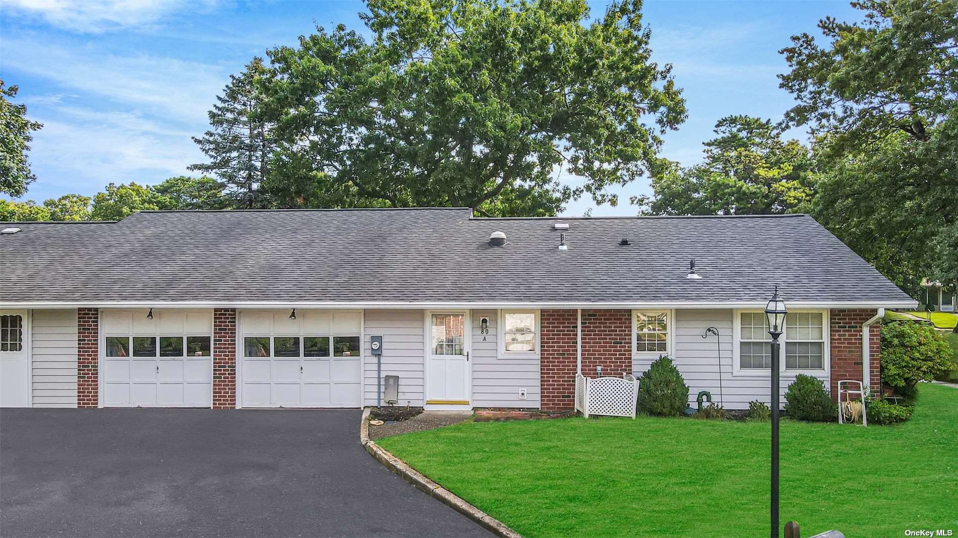 80 Enfield Court, Unit A Ridge, NY 11961 - Photo 1 of 1 a view of house with a yard