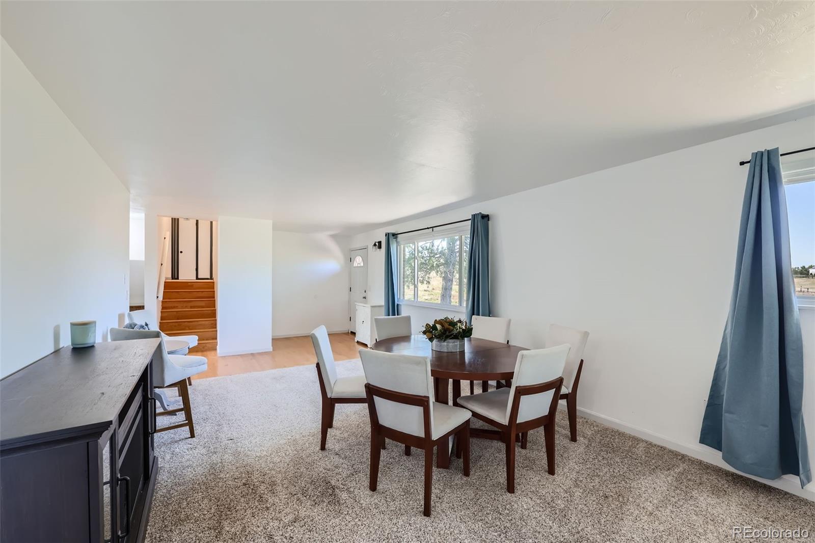 2452 Shetland Trail Elizabeth, CO 80107 - Photo 11 of 42 a view of a dining room with furniture