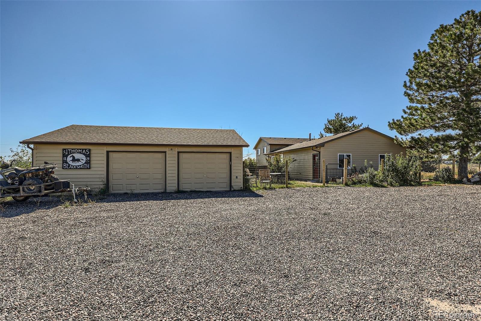 2452 Shetland Trail Elizabeth, CO 80107 - Photo 27 of 42 a house with trees in the background