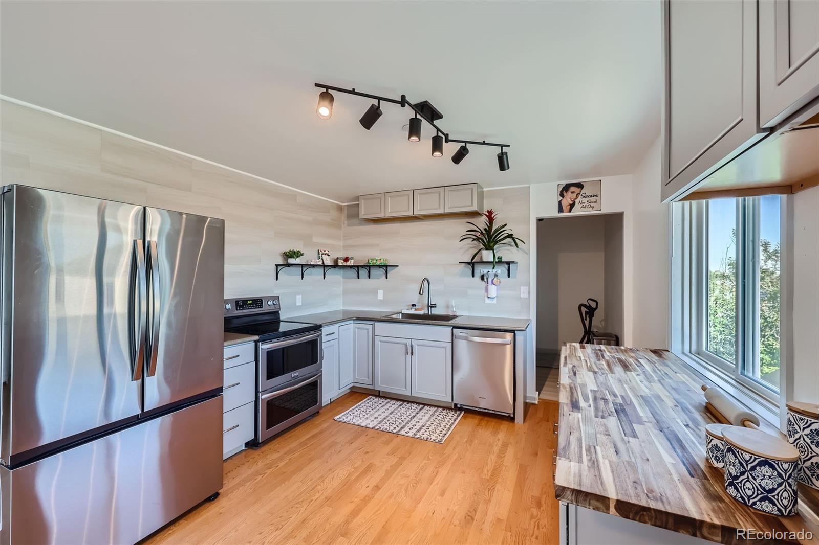 2452 Shetland Trail Elizabeth, CO 80107 - Photo 9 of 42 a kitchen with granite countertop stainless steel appliances a sink and refrigerator