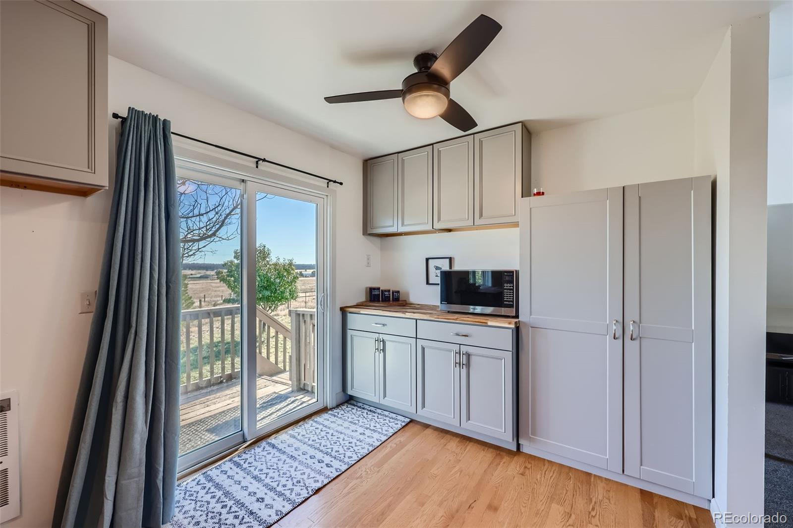 2452 Shetland Trail Elizabeth, CO 80107 - Photo 10 of 42 a kitchen with stainless steel appliances granite countertop a refrigerator a sink and white cabinets