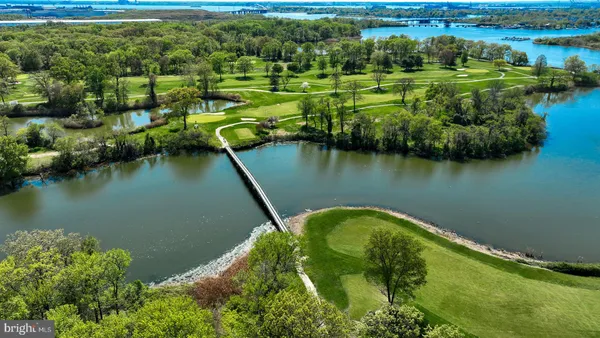 an aerial view of a house with a lake view