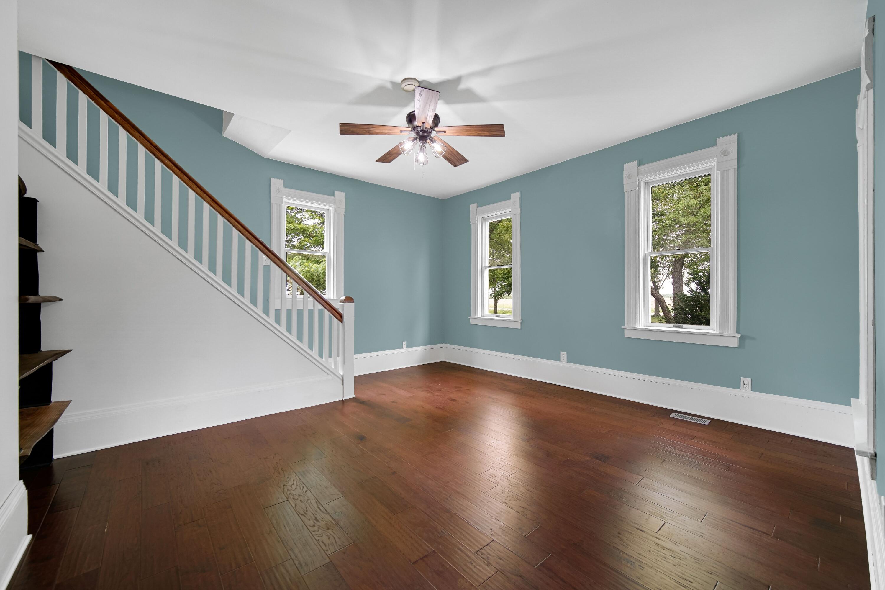 476 Highway 2 Hebron, IN 46341 - Photo 12 of 25 a view of an entryway with wooden floor windows and a ceiling fan