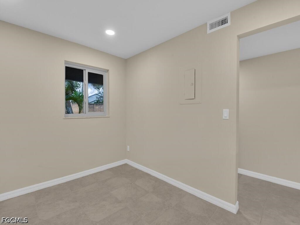 16560 Partridge Place Road, Unit 101 Fort Myers, FL 33908 - Photo 7 of 27 an empty room with windows