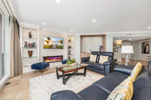 a large kitchen with stainless steel appliances kitchen island granite countertop a sink and cabinets