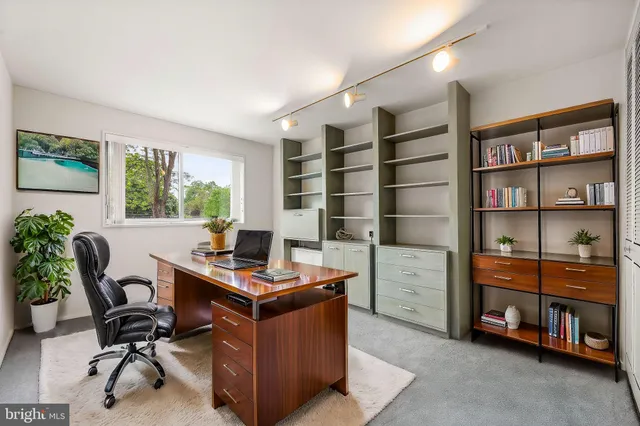 a view of workspace with furniture and window
